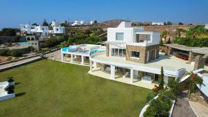 an aerial view of a villa with a large yard at Alegria Mykonos 7 Suites in Kalafatis