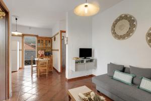 a living room with a couch and a table at La Casa Amarilla in El Paso