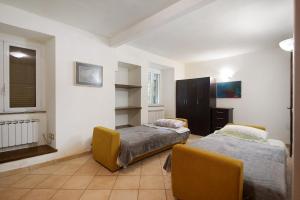 a room with two beds and a window at Levanto A 50 Metri dal Mare in Levanto