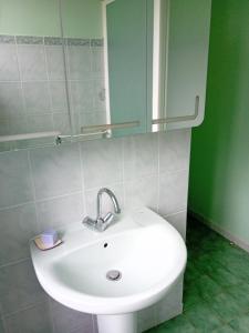 a bathroom with a white sink and a mirror at La Maison De Carmensac in Meyrals +11 photos