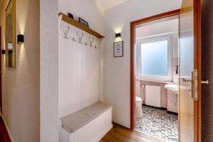a small bathroom with a toilet and a sink at Ut Huuske in Dorsel +23 photos