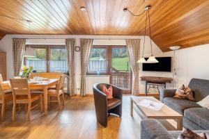 a living room with a couch and a table at Schätzlehof in Oberwinden