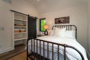 a bedroom with a bed and a window at Hemlock Cottage · Hemlock Cottage in Pisgah Forest - Pet Friendl in Brevard