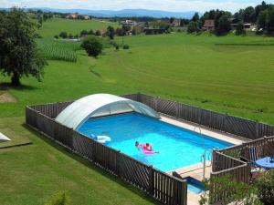 an overhead view of a swimming pool with people in it at Fewo Siglinde Schneider in Freiamt