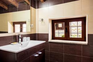 a bathroom with a sink and a window at Casa La Charca in Amavida +16 photos