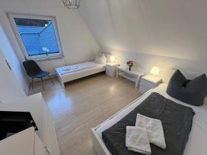 a living room with a couch and a window at Ferienhaus Almir in Haselünne