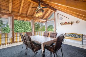 a dining room with a table and chairs at Ferienwohnung Viola in Schwanau in Schwanau