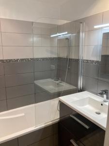 a white bathroom with a sink and a shower at Plage du Couchant in La Grande Motte +13 photos