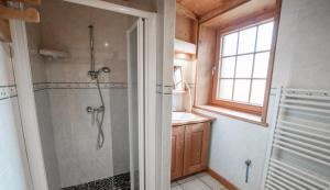 a bathroom with a shower and a sink at Chalet Les Liouès in Sollières-Sardières +67 photos