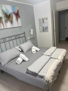 a bedroom with a bed with two towels on it at Residence Tatiana Dependance in Tremosine Sul Garda +27 photos