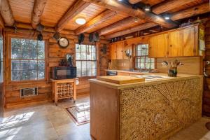 a kitchen with a large island in a cabin at Great Escape Cabin · Great Escape Cabin in Connestee Falls in Brevard