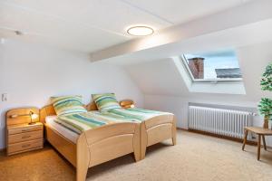 a bedroom with a bed and a window at Ferienhaus Albert in Bühl