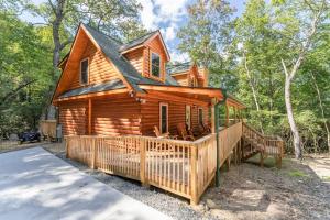 a cabin in the woods with a large deck at Hideaway Cabin · Hideaway Cabin in Cedar Mountain in Cedar Mountain