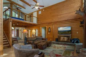 a living room filled with furniture and a fireplace at Blissful Bears Mountain · Blissful Bear Cabin, Long Range View 2 in Brevard
