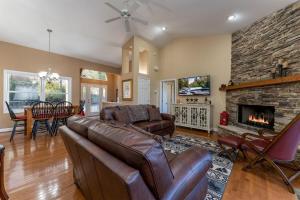 a living room with a couch and a fireplace at Bearly Ruffin It · Bearly Ruffin It in Connestee Falls in Brevard