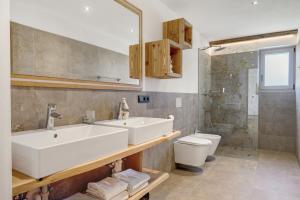 a bathroom with a sink and a toilet at Moarhof in Meltina +124 photos