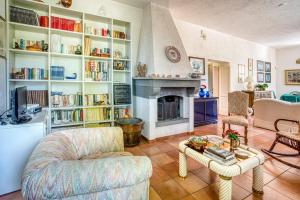 a living room with a couch and a fireplace at Palazzetto Bovini in Perugia