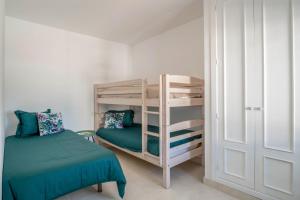a bedroom with two bunk beds and a ladder at Villa Esmeralda in Lanzarote +20 photos