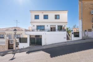 a white house on the side of a street at Ca La Morancica in Yátova