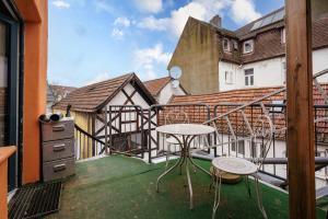 a balcony with a table and chairs on it at Haus Hauptstrasse 23a in Bühl