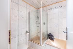 a bathroom with a shower and a toilet at Ferienwohnung Käppeleblick in Bernau im Schwarzwald +28 photos