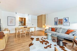 a living room with a couch and a table at Ferienwohnung Schluchsee Idylle in Schluchsee