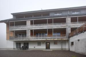 an apartment building with balconies on the side of it at Haus Wiesenquelle in Feldberg