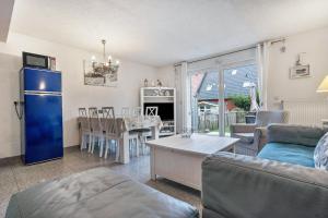 a living room with a couch and a table at Ostsee in Pruchten