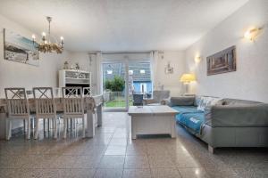 a living room with a couch and a table at Ostsee in Pruchten +26 photos
