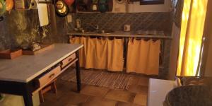 a kitchen with a sink and a counter top at Antico Dammuso Al Tramonto in Pantelleria