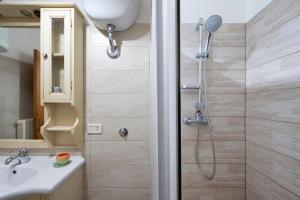 a bathroom with a shower and a sink at Casa di Titina a Otranto in Otranto +15 photos
