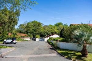 a car parked in the driveway of a house at Appartement de charme - spa privé in Biarritz +14 photos