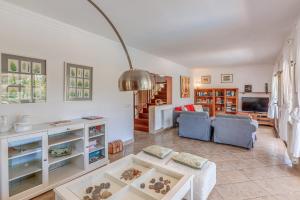 a living room with a couch and a table at Casa Caterina in Port de Soller