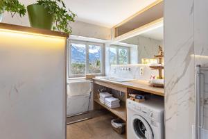 a laundry room with a washer and dryer at Haus Alpenveilchen - Appartement 2 in Schönau am Königssee