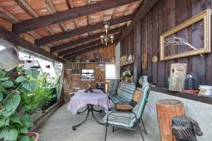 an outdoor patio with a table and chairs at Ferienhaus am Blumengässle in Feldberg