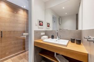 a bathroom with a sink and a shower at Doppelzimmer Mit Terrasse in Schmallenberg