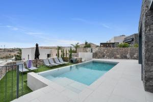 a swimming pool on the roof of a house at Yucas Villa 17 in San Bartolomé