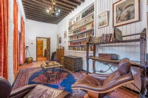 a living room with a couch and a chair and a table at Carmen San Andrés in Granada
