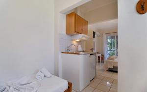 a kitchen with a sink and a counter top at S6 apartment in Nikiana