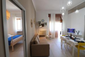 a living room with a couch and a table at Casa Vacanze Nike a Otranto in Otranto