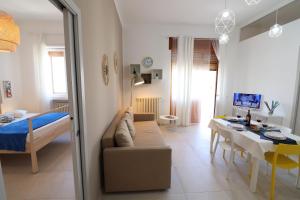 a living room with a couch and a table at Casa Vacanze Nike a Otranto in Otranto