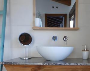 a bathroom with a white sink and a mirror at Casa Rural Fuentebuena in Matabuena