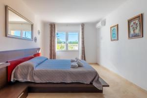 a bedroom with a bed and a window at Villa Cucarres in Calpe +34 photos
