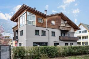 an apartment building with a wooden roof at Plose 35 in Bressanone