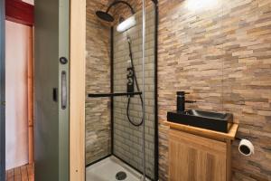a bathroom with a sink and a shower at L'auberge du Bati in Besse +20 photos