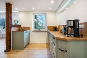 a kitchen with a sink and a counter top at Ferienwohnung Manthei in Kluis