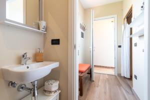 a bathroom with a sink and a mirror at A Look Salento in Castrignano del Capo +25 photos
