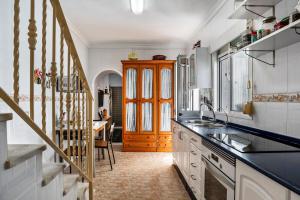 a kitchen with a sink and a counter top at Casa Calle Ancha in Barbate