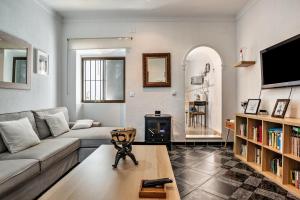 a living room with a couch and a table at Casa Calle Ancha in Barbate