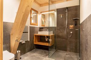 a bathroom with a sink and a shower at Zu Grof Alpenglühn in Castelrotto +19 photos